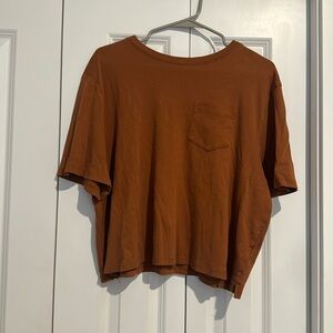 Burnt orange tee size: large